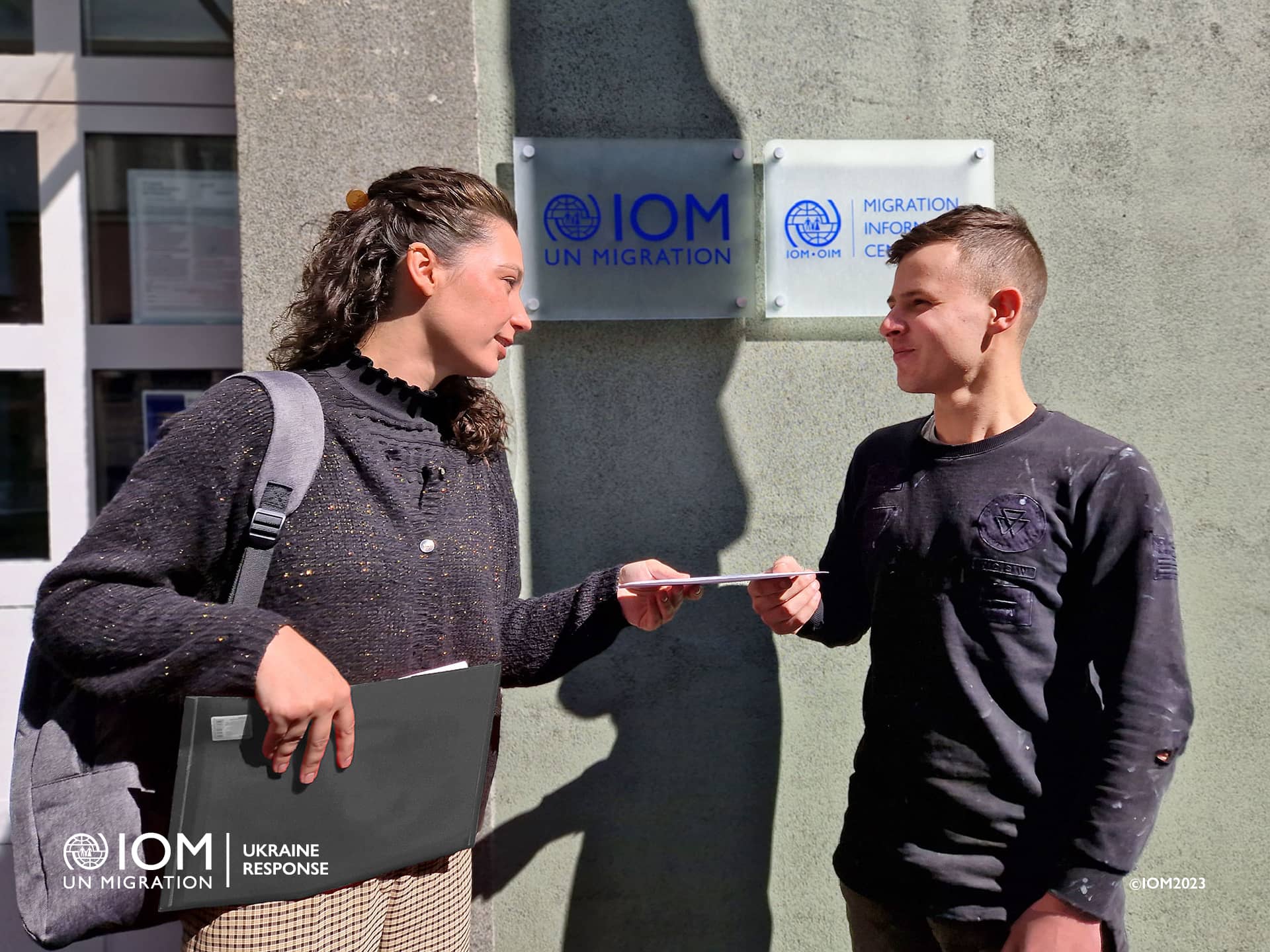 Photo - Olexander (22) is picking up up financial aid from IOM Slovakia. Photo © International Organization for Migration (IOM). 